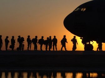 Soldiers in Line to Get in a Plane