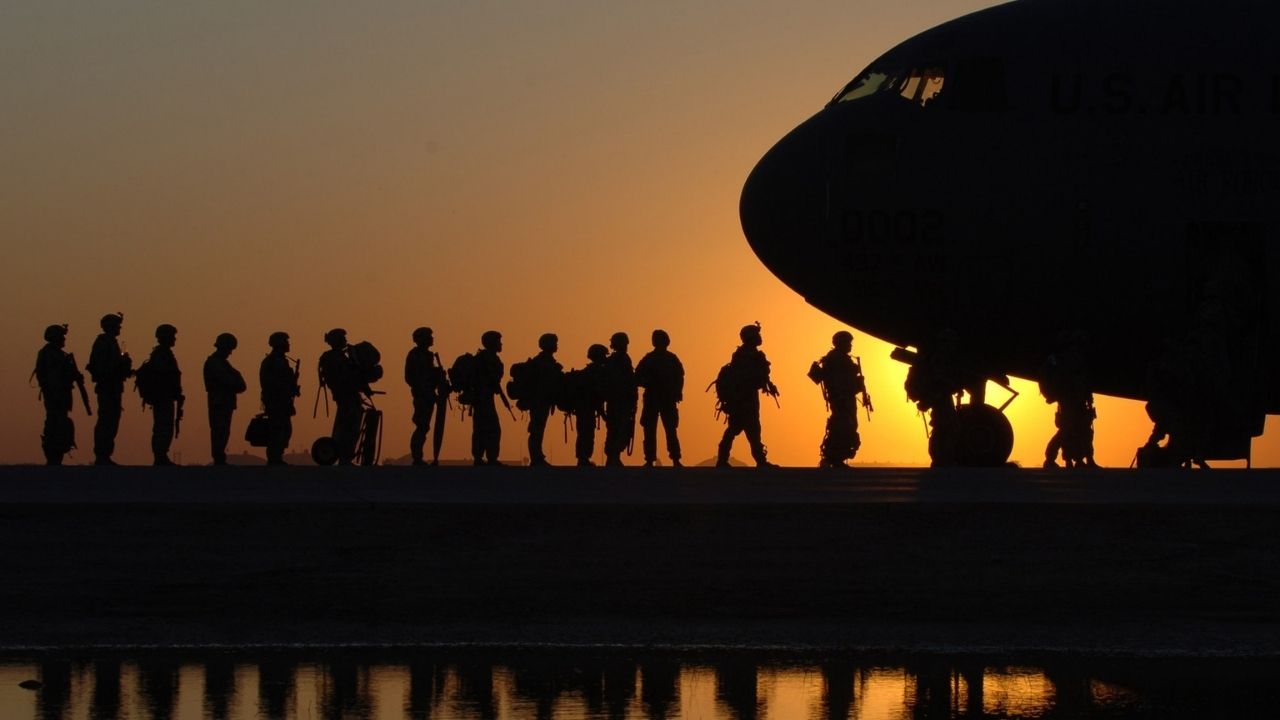 Soldiers in Line to Get in a Plane