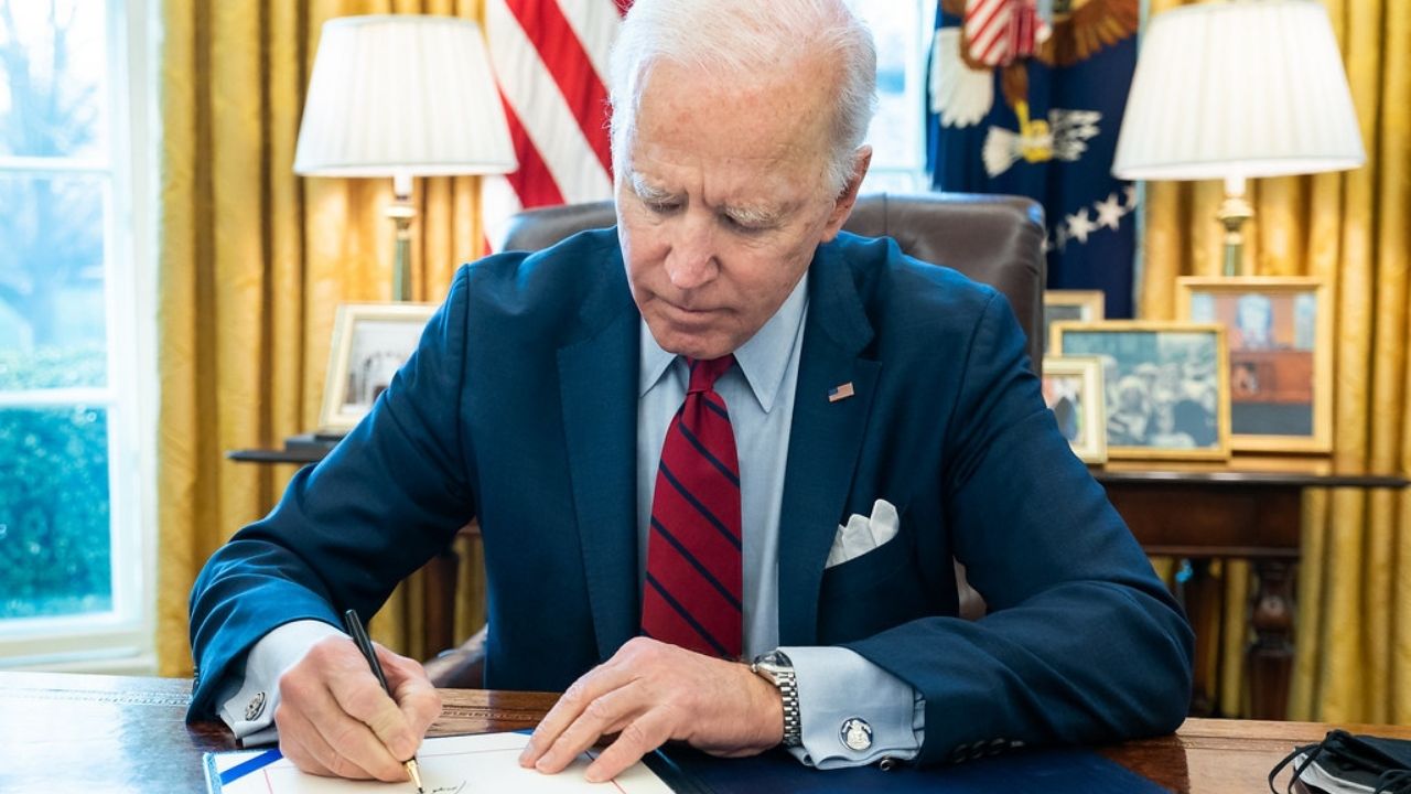 President Joe Biden signs a bill, S. 579, the ALS Disability Insurance Access Act of 2019 which retroactively gives access to Social Security disability benefits for individuals with ALS Tuesday, March 23, 2021, in the Oval Office of the White House. (Official White House Photo by Adam Schultz)