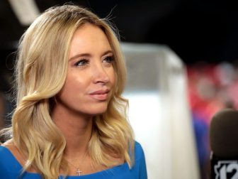Kayleigh McEnany speaking with the media at a "Keep America Great" rally for President of the United States Donald Trump at Arizona Veterans Memorial Coliseum in Phoenix, Arizona.