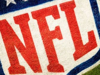 The NFL grass logo is shown in the stock image above.