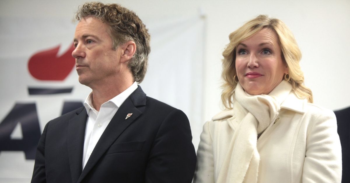 U.S. Senator Rand Paul and his wife, Kelley Paul, speaking with supporters at a campaign office visit at his Iowa campaign headquarters in Des Moines, Iowa.