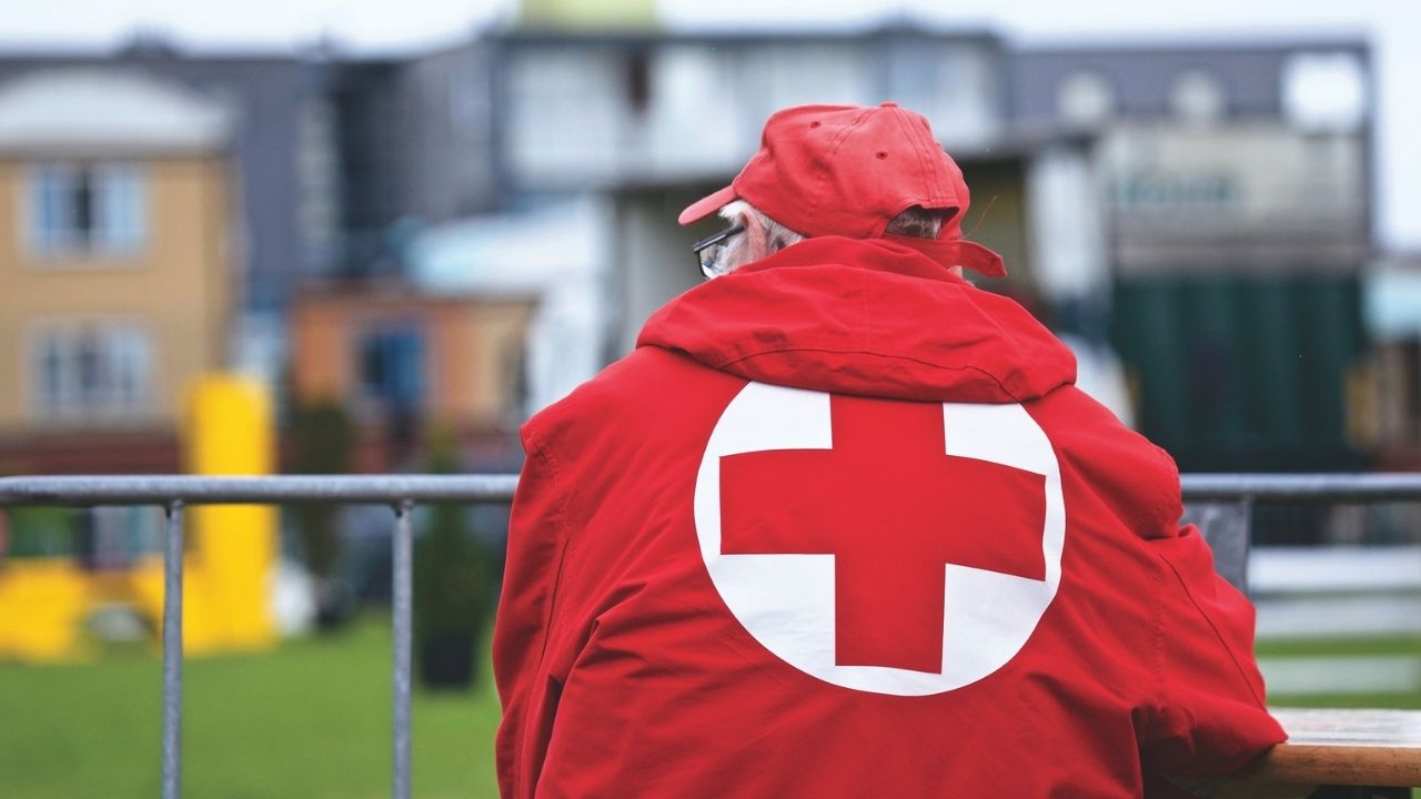 Man in a Red Cross jacket