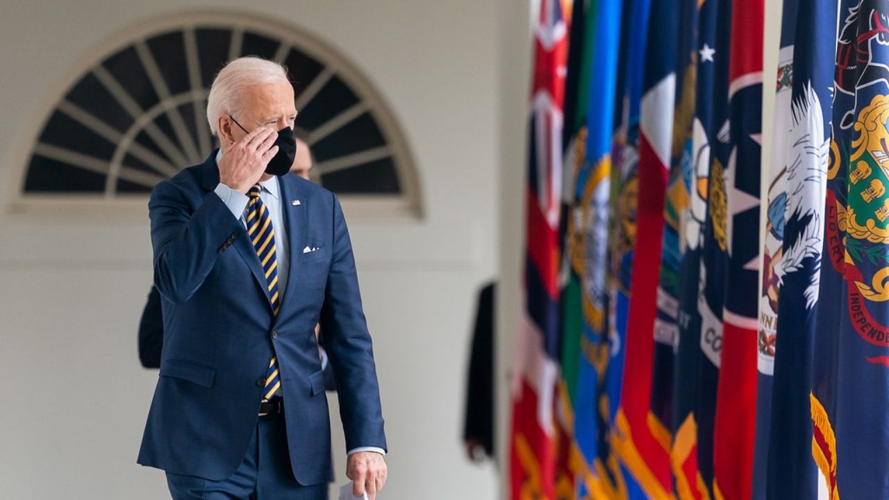 President Joe Biden salutes as he walks along the Colonnade of the White House on Friday, March 12, 2021, en route to the Oval Office. (Official White House Photo by Adam Schultz)