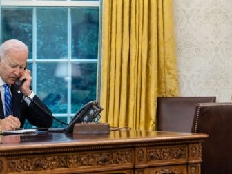 President Joe Biden talks on the phone with First Lady Jill Biden, Monday, Aug. 2, 2021, in the Oval Office of the White House.