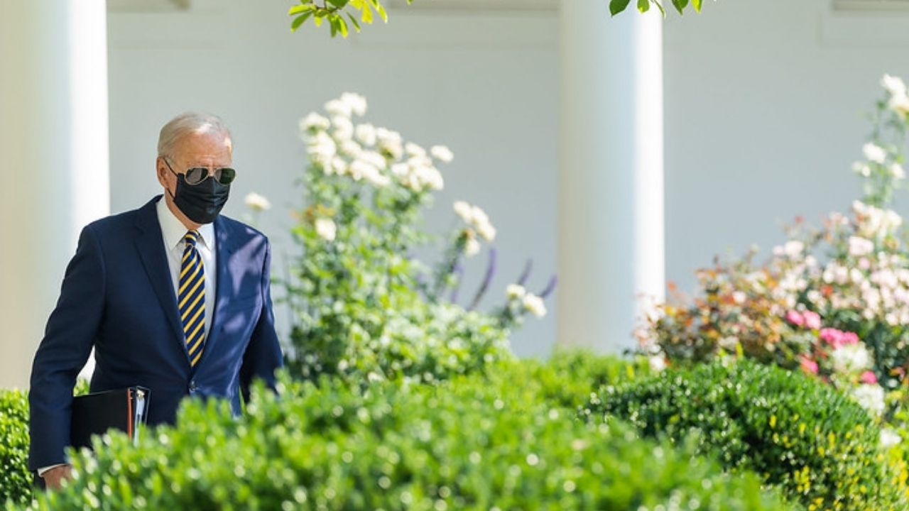 President Joe Biden walks through the Rose Garden of the White House on Wednesday, July 28, 2021, to the Oval Office.