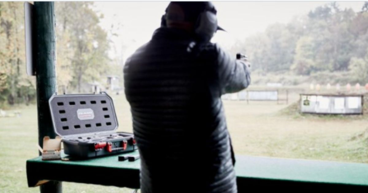 An advertisement for Rustrictor Technology shows a man on a gun range, shooting at targets with a handgun.