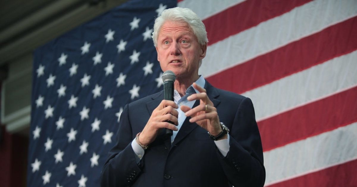 Former President Bill Clinton speaking with supporters at a campaign rally for his wife, former Secretary of State Hillary Clinton, at Central High School in Phoenix, Arizona.