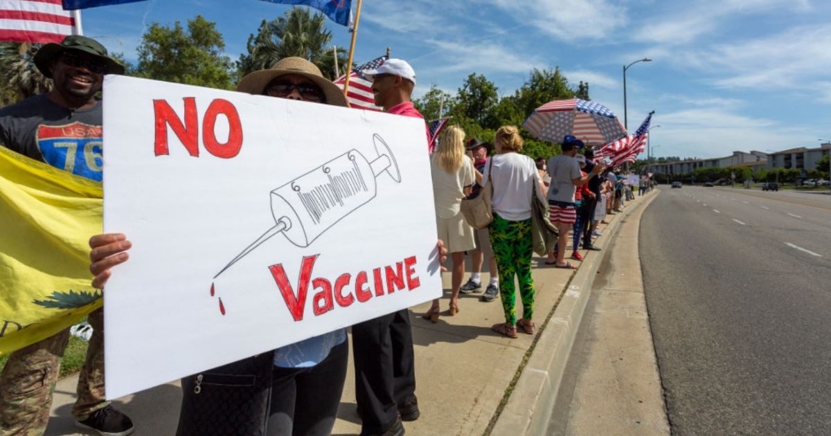 People gather to protest the COVID-19 vaccine mandate in California. This upcoming weekend, more protests will be held across the U.S.