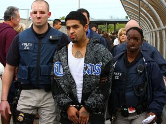 U.S. Immigration and Customs Enforcement agents make an arrest on Dec. 21, 2008.
