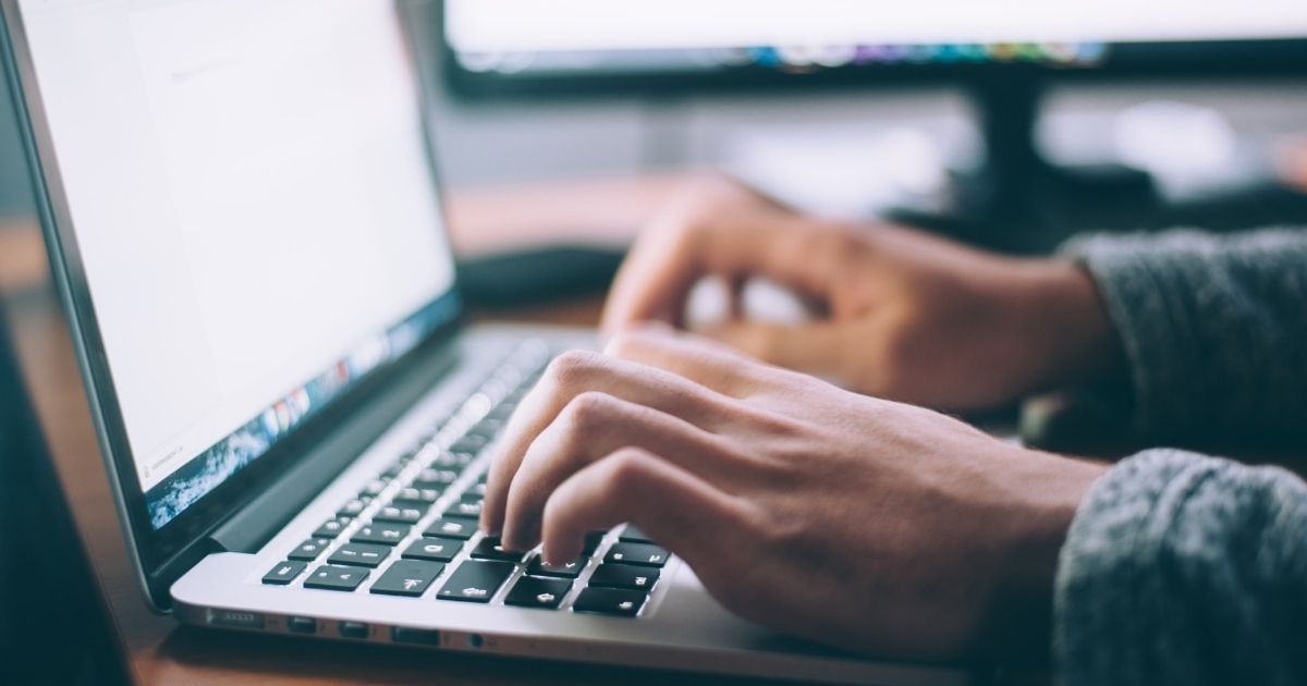 Person working on MacBook Pro