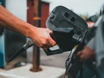 Picture of someone putting gas into a car.