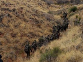 On Feb. 3, a photo shows a group of 20 illegal immigrants attempting to hide in the brush near Van Horn, Texas, using camouflage.
