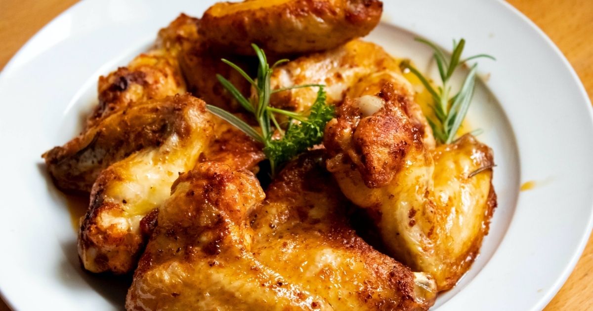 Cooked chicken on a plate. (Harry Dona / Pexels)