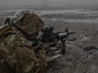 A U.S. Soldier assigned to the Michigan National Guard engages targets with his M4 rifle during the Governor’s Twenty marksmanship competition at Camp Grayling Maneuver Training Center, Michigan, November 2, 2021. Soldiers compete in four rifle and five pistol events over a three-day period, with the top 20 percent receiving a special Governor’s Twenty tab to wear on their combat uniforms. (U.S. Army National Guard photo by Capt. Joe Legros)