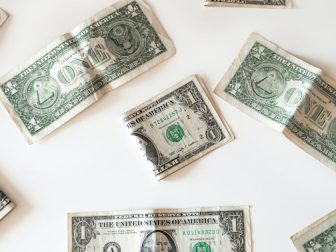 Folded dollar. (Emilio Takas / Unsplash)