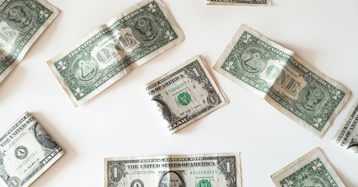 Folded dollar. (Emilio Takas / Unsplash)