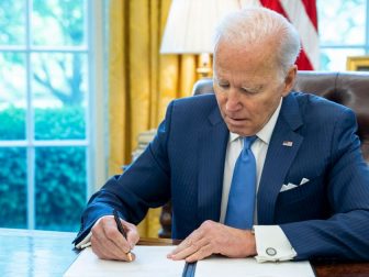 President Joe Biden signs a letter to Speaker of the House Nancy Pelosi, D-Calif., Thursday, April 28, 2022, in the Oval Office. (The White House / Adam Schultz / Flickr)