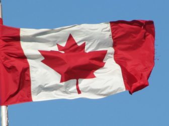 Canadian flag flying above the unfree country of Canada