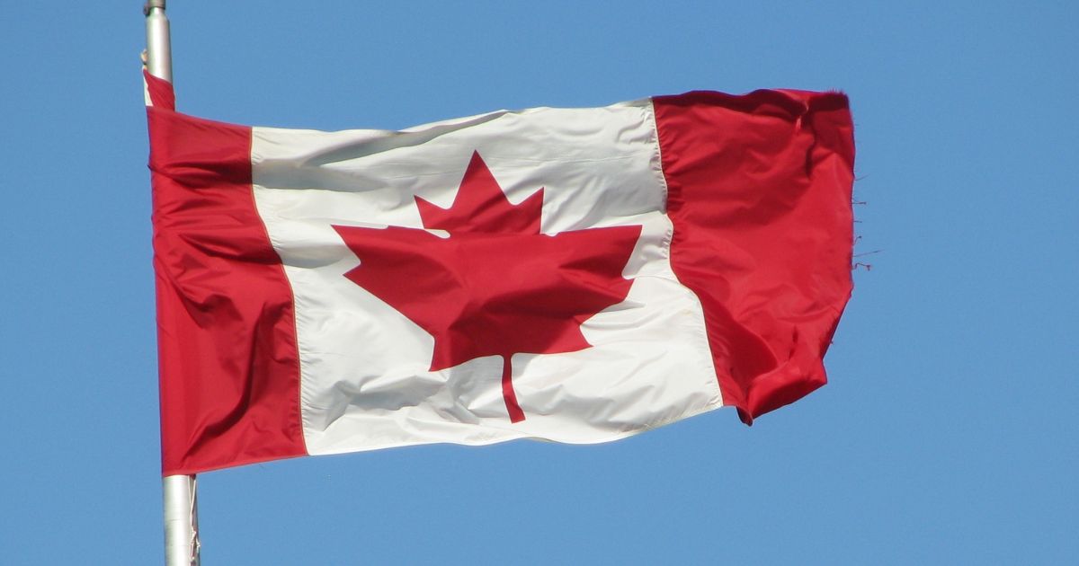 Canadian flag flying above the unfree country of Canada