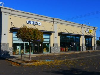 A Geico Insurance store front is seen in this photo in Eugene, Oregon.