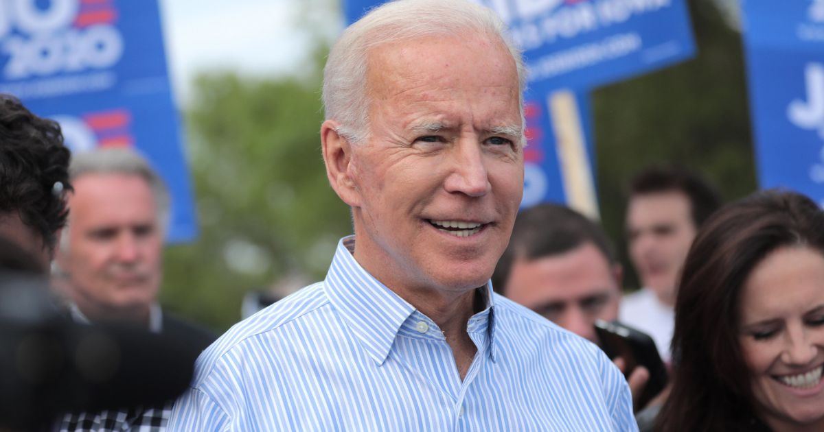 Former Vice President of the United States Joe Biden walking with supporters at a pre-Wing Ding march from Molly McGowan Park in Clear Lake, Iowa.