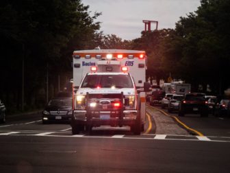 An ambulance is seen with its sirens on in this photo.