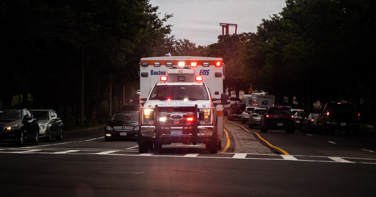 An ambulance is seen with its sirens on in this photo.