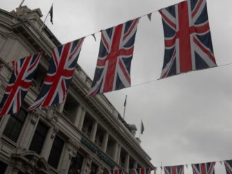 Union Jack flags are seen over Coventry Street.