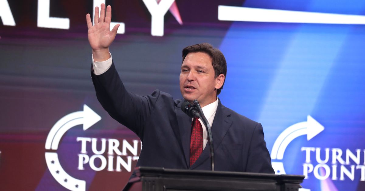 Governor Ron DeSantis speaking with attendees at a "Unite & Win Rally" at Arizona Financial Theatre in Phoenix, Arizona.