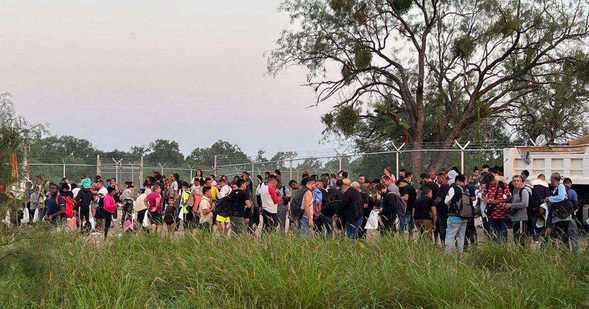 The above image is a group of migrants crossing into Eagle Pass, Texas.