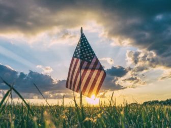 American flag in the grass.