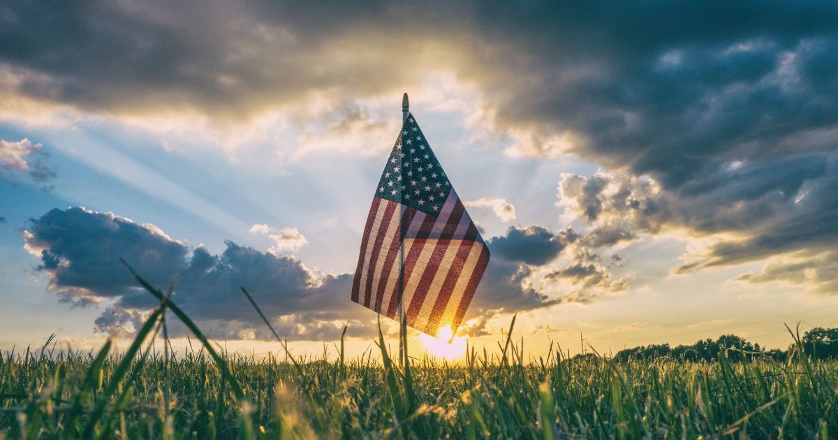 American flag in the grass.