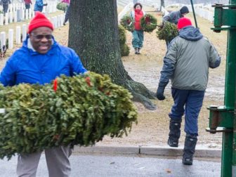 Justice Clarence Thomas cleans up Arlington National Cemetery in January 2013.