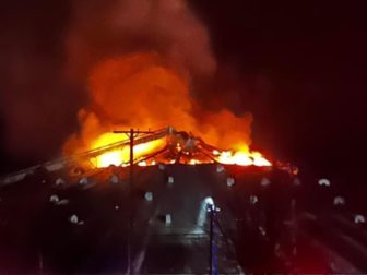 A fire started Sunday at a grain elevator in Hemlock, Michigan, and firefighters are now saying it could take up to a week to extinguish the flames.