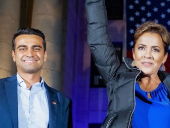 Arizona Republican candidates Abe Hamadeh and Kari Lake stand together.