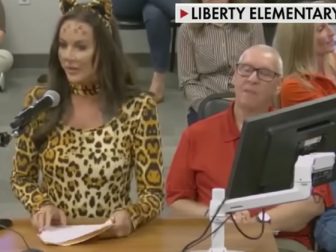 Lindsey Graham, a mother and activist, wears a cat costume to a school board meeting in Arizona in November.