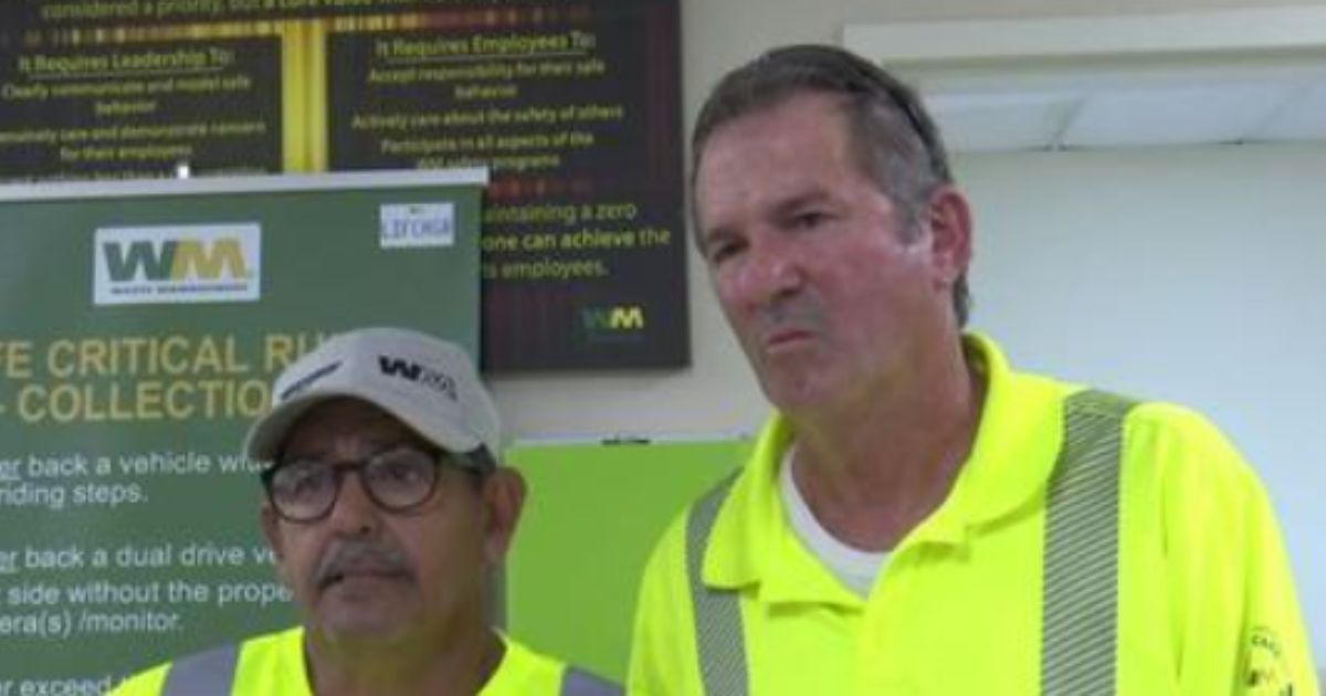 Two waste management workers saved an elderly man after he became trapped under a golf cart.