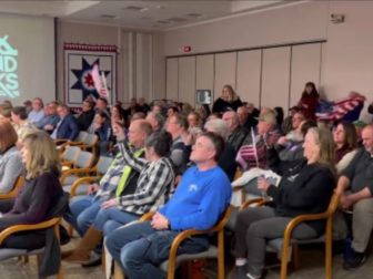 Residents cheer after the Grand Forks, North Dakota, City Council voted to shut down a Chinese corn mill project on Monday.