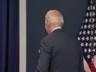 President Joe Biden leaves a news conference on Thursday.