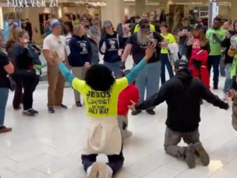 A group of demonstrators, many wearing "Jesus Is The Only Way" shirts, gathered at the Mall of America on Saturday to show support for preacher Paul Shoro.