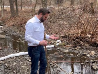 Ohio Sen. J.D. Vance visits a creek near East Palestine, Ohio.