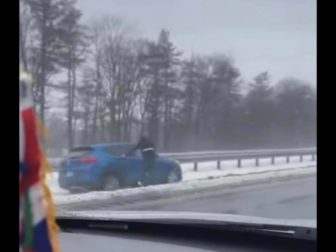 Adolfo Molina helps a woman who lost consciousness while driving.