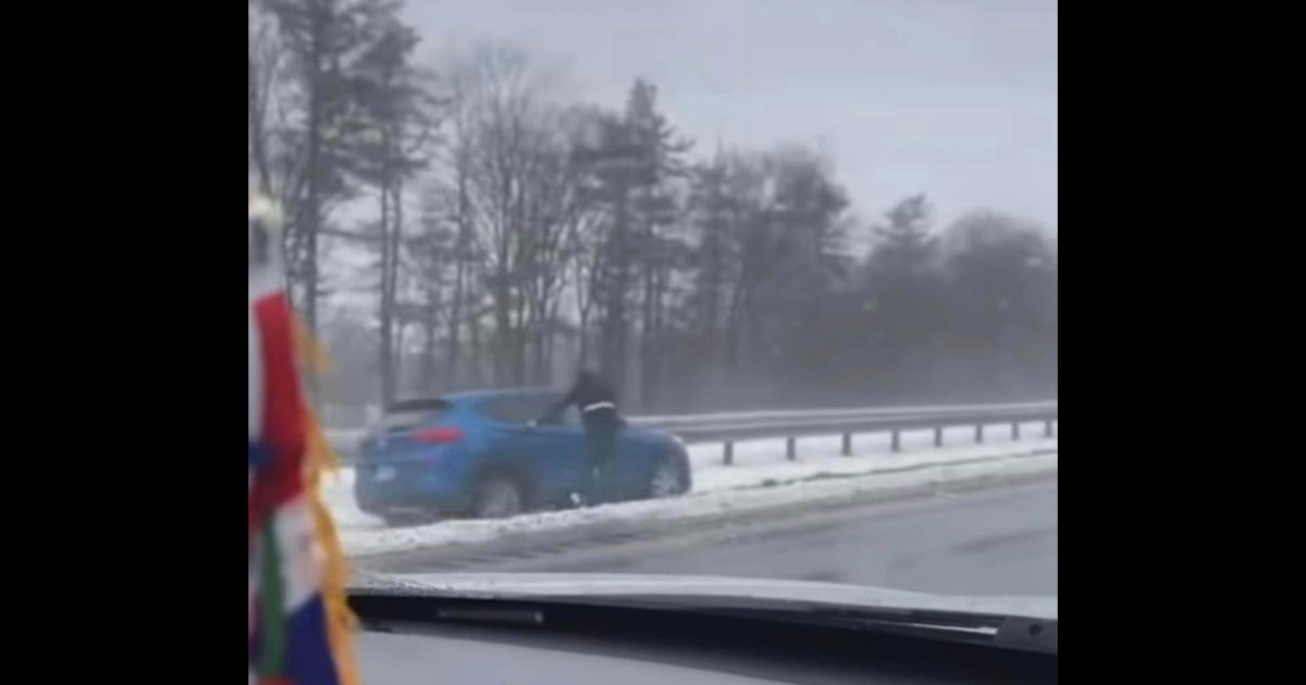 Adolfo Molina helps a woman who lost consciousness while driving.