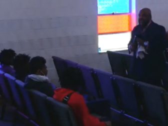 The pastor confronts four young men at All Creation Northview Holiness Family Church in Ferguson, Missouri.