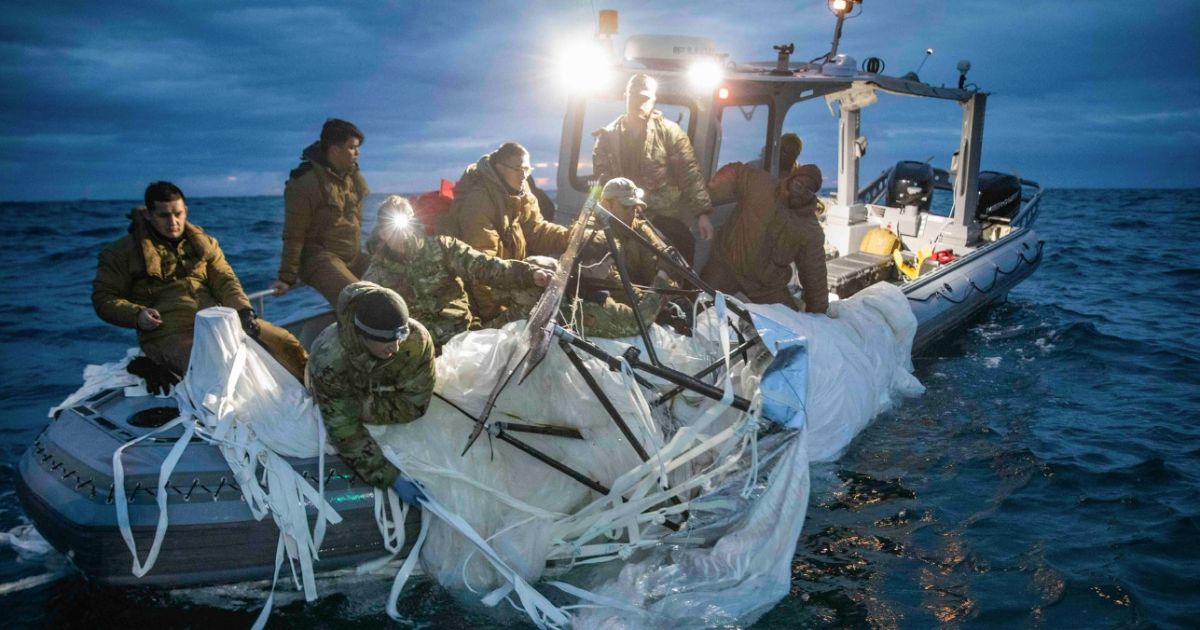 This screen shot shows Navy sailors recovering the remnants of the Chinese spy balloon off the coast of Myrtle Beach, South Carolina on February 5, 2023.