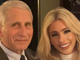 Melissa Rein Lively, right, stood for a photo with Dr. Anthony Fauci, left, who believed she was a fan of his, but her gesture in the photo tells a different story.