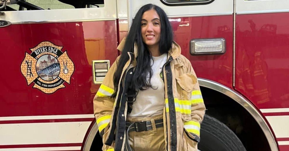 Gisele Barreto Fetterman, the wife of Pennsylvania Sen. John Fetterman, poses next to a fire truck.