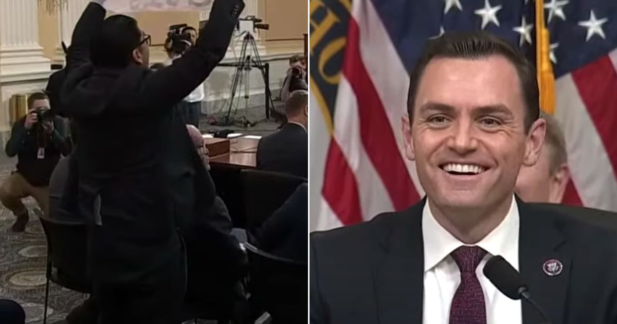 Committee Chairman Mike Gallagher, right, a Wisconsin Republican, laughed at the protester with the upside-down sign, left.