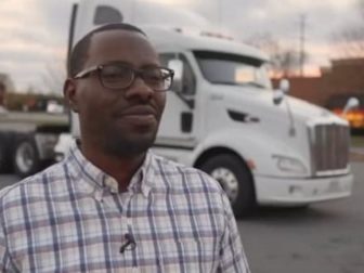 Jerry Johnson, a North Carolina resident and owner of a small trucking company, stands with a semi in the background.